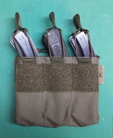 Triple 10/22 magazine pouch.  This pouch is available in a number of tactical colors and attaches to your MOLLE gear via MALICE clips.  It is constructed of 1000D cordura nylon.